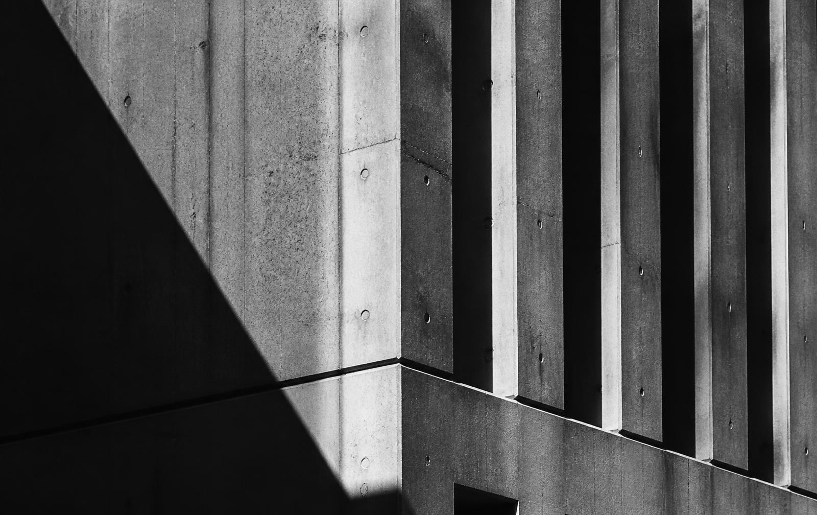 Raking light across a concrete facade